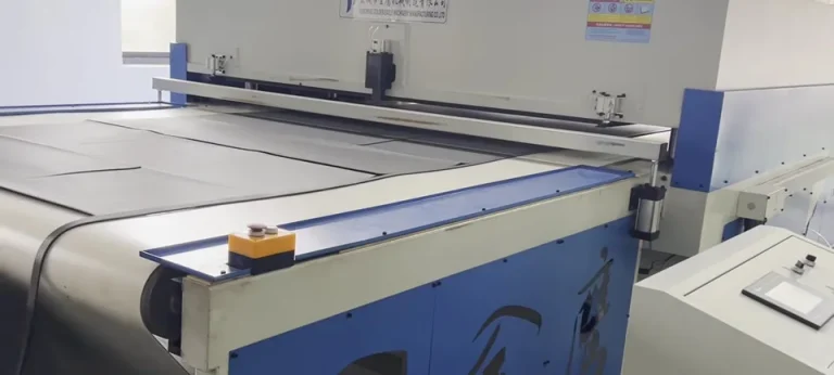 Carpet tile outlines on the output belt of the GEA-B1200 cutting press